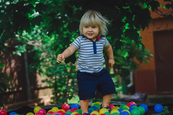 Cute Blonde Boy Play Colored Balls Outdoor Green Yard — Stock Photo, Image