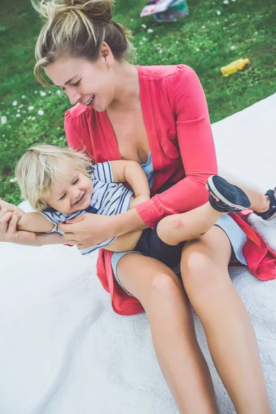 Young Blonde Woman Tickle Cute Boy Green Grass Outdoor — Stock Photo, Image