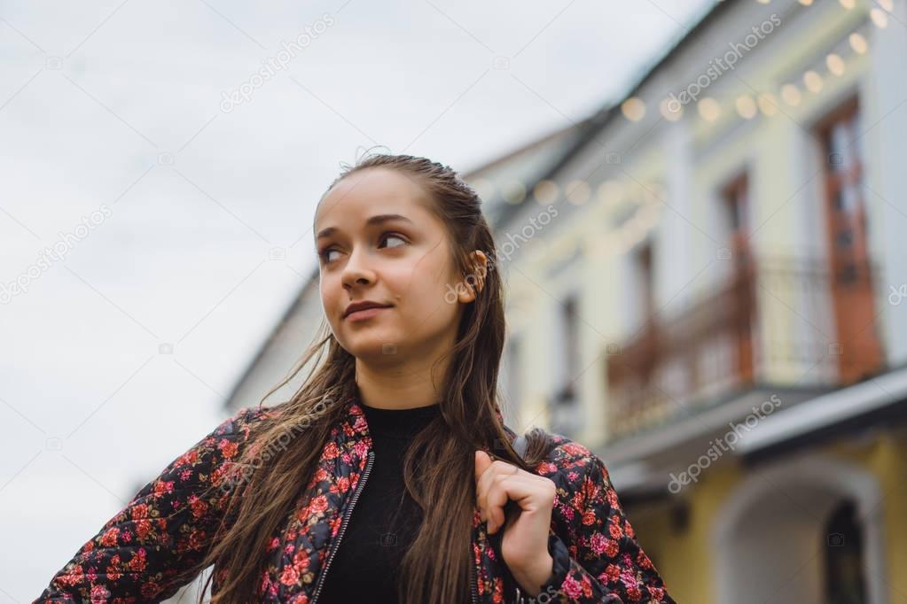 Young woman posing on street