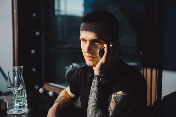 Young man calling on phone — Stok fotoğraf