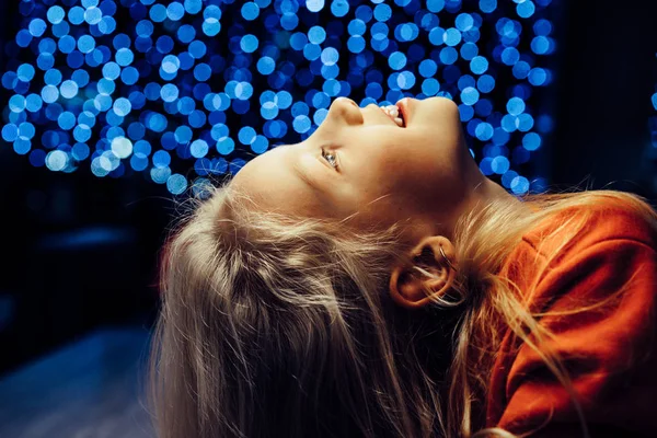 Brother and sister on the background of a festive garland, New Y — Stock Photo, Image