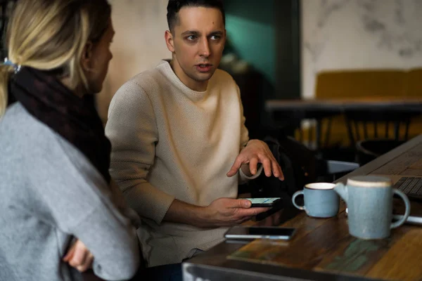 Young Man Drinks Tea Works Laptop Freelancer Working Cafe — 스톡 사진