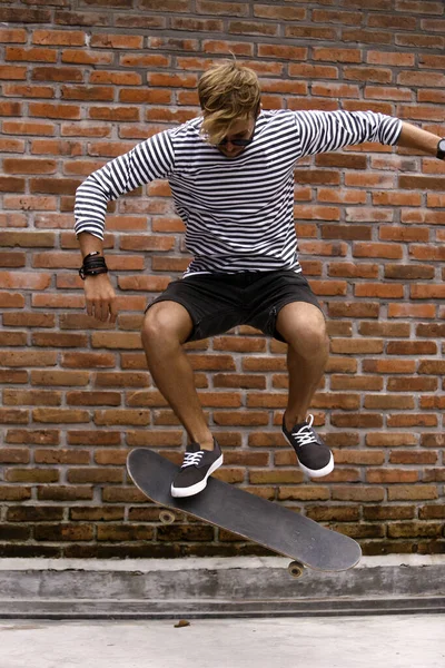 young man doing skateboard tricks