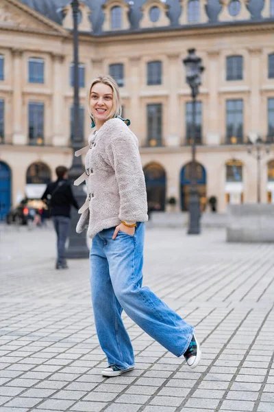 young beautiful woman walks in Paris. The concept of a happy travel photo.