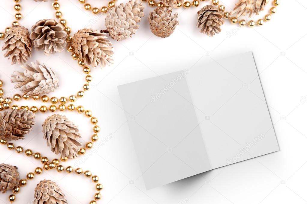Christmas flat lay mockup desktop image with pine cones and open card