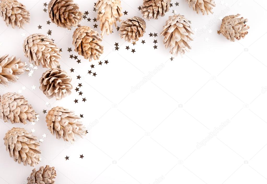 Christmas flat lay mockup desktop, pine cones and sequins on a white background