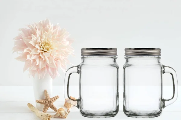 Floral mock-up of 2 mason jars, with lids