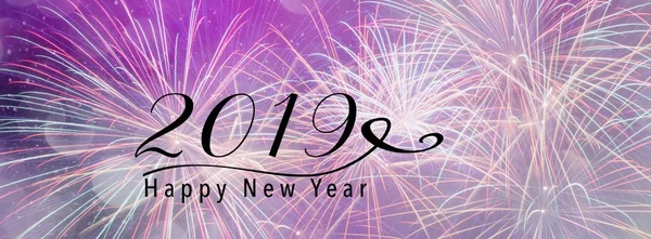 Fireworks against a purple backdrop with bokeh and falling snow effect. Happy New Year 2019 quote. Panoramic banner style. Scales down to fit a facebook header size.