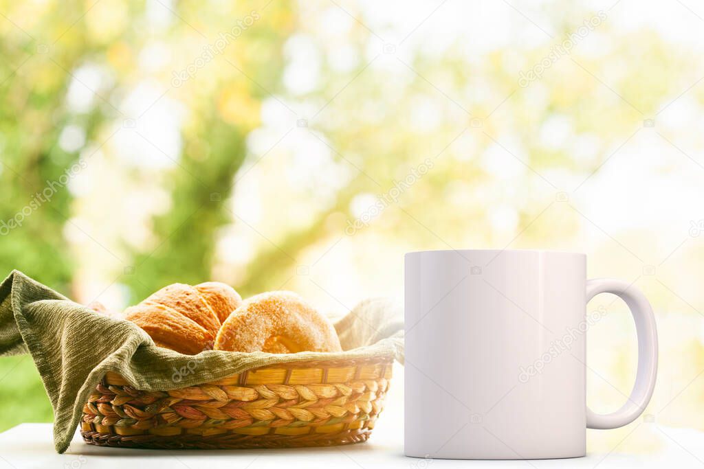 White Mug Mockup, next to a basket of bread. Perfect for businesses selling mugs, just overlay your quote or design on to the image.