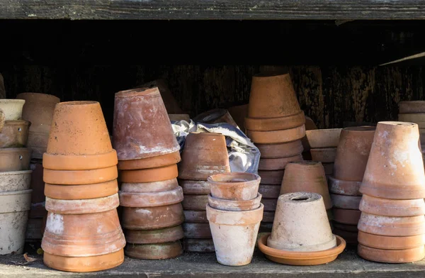 Rustic vintage stacks of terracotta flower pots — стоковое фото