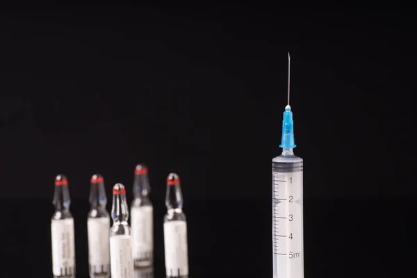 Medical syringe and vials — Stock Photo, Image