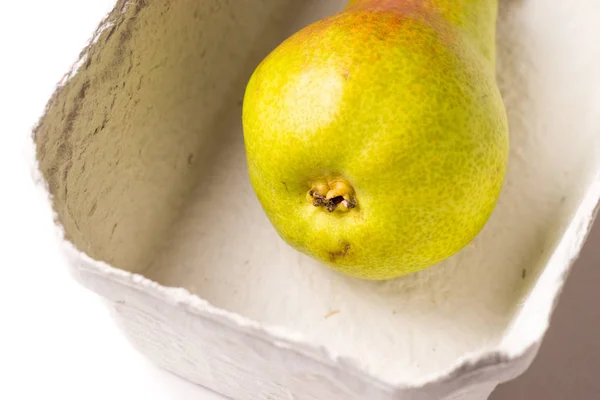 One Red Green Organic Pear Eco Friendly Container — Stock Photo, Image