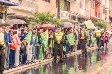 Supporters With Police Men Of Ecuador Waiting For The President  clipart