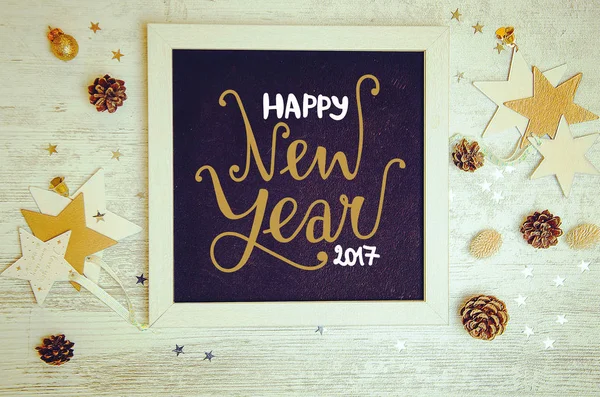 New Year decorations and objects flat lay photo with black chalkboard frame — Stock Photo, Image