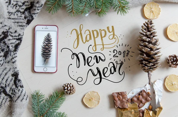 Christmas and New Year flat lay background with hand lettering greeting. — Stock Photo, Image