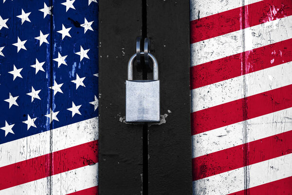 United states of america flag on a  door with a padlock, protectionism