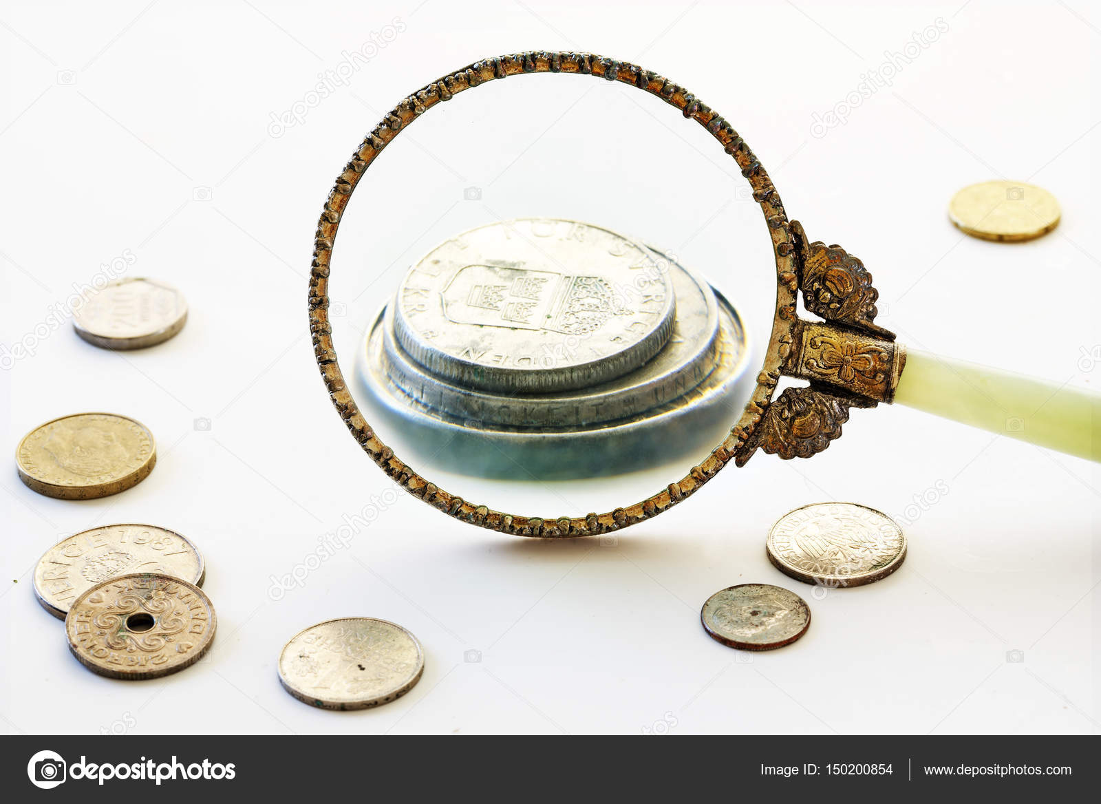 Capital increase, magnifying glass enlarge a few coins, bright