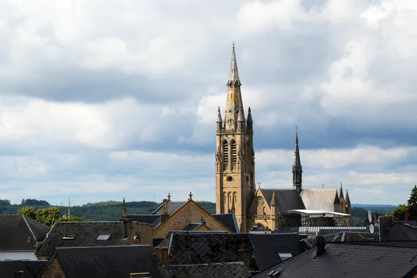 Church of arlon over the roofs of the old town against a cloudy sky with copy space, belgium, europe — Stock Photo, Image