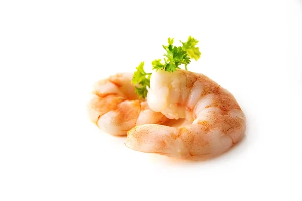 Tiger prawn shrimps, peeled and boiled, parsley garnish, isolated on a white background, close up — Stock Photo, Image