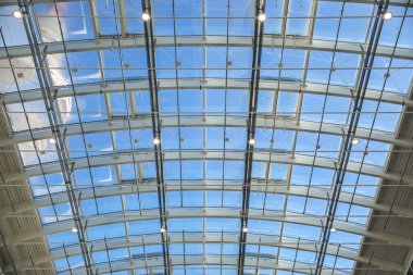 Hamburg, Germany, February 05, 2020: Semicircular roof construction of steel and glass in the modern building of the Hamburg exhibition halls under a blue sky