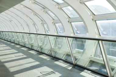 Hamburg, Germany, February 05, 2020: Pedestrian bridge in the Hamburg exhibition halls from steel and glass with attractive shadows
