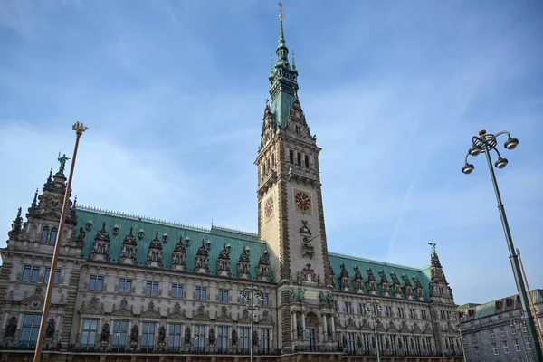 Historical town hall with clock tower in the city of Hamburg against a blue sky with clouds, copy space — 图库照片