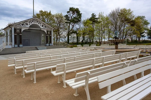Locked open air stage and empty spectator benches near the beach during the coronavirus pandemic in the famous tourist resort Boltenhagen on the Baltic Sea, Germany, selected focus