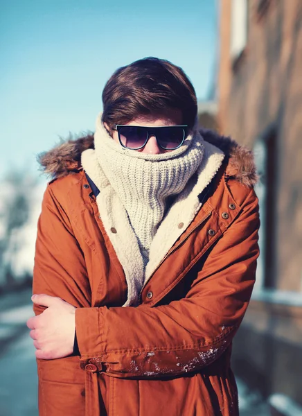 Fashion portrait hipster man freezes hides his head and warms bo — Stock Photo, Image