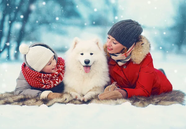 Christmas happy family, mother and son child walking with white — Stock Photo, Image