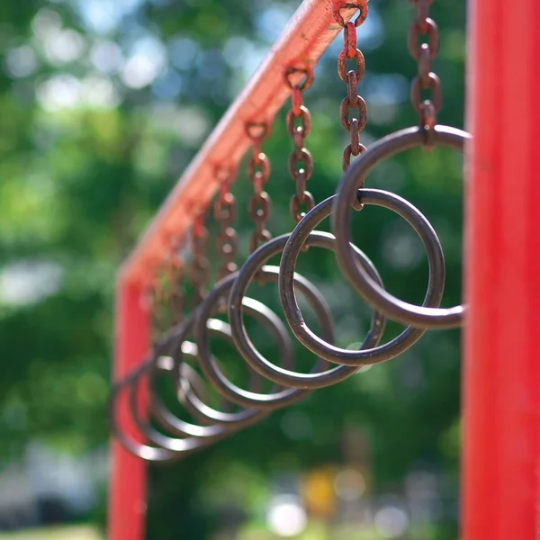 Street workout, rings outdoors, sport equipment concept