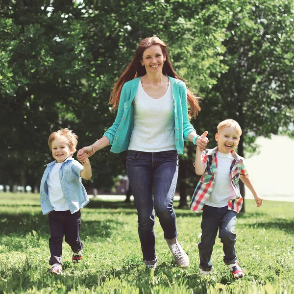 Happy family is having fun, mother and two children sons playing — Stock Photo, Image