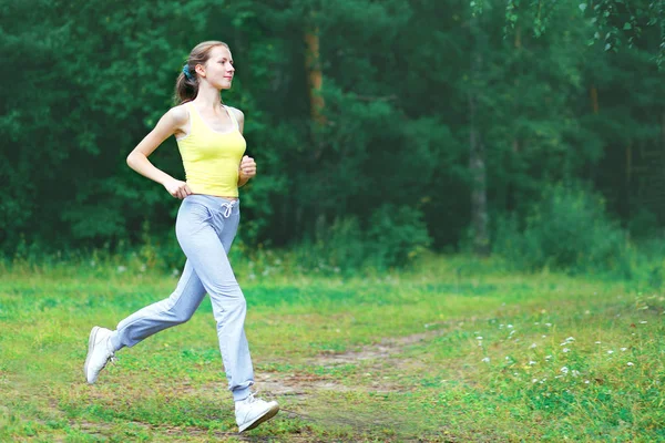 Sport, fitness and healthy lifestyle concept - sporty woman runn — Stock Photo, Image