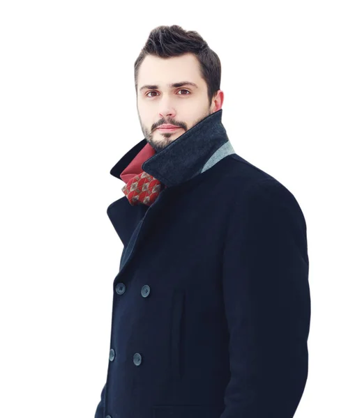 Bello uomo modello in un cappotto isolato su sfondo bianco — Foto Stock