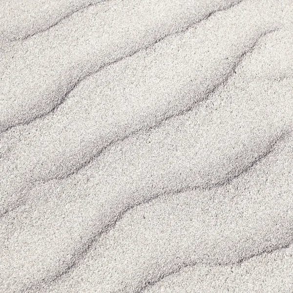 Konsistens av vit sandstrand för bakgrunden närbild — Stockfoto