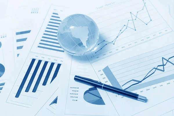 Business presentation with glboe and chart on the desk — Stock Photo, Image