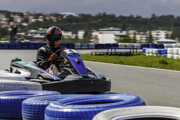 Karting Championship. Driver in karts wearing helmet, racing suit participate in kart race. Karting show. Children, adult racers karting. — Stock Photo, Image