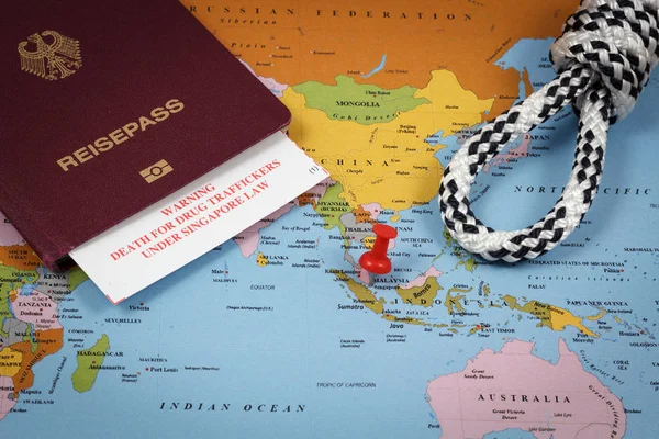Singapore map, passport, hangmans knot and immigration card with death penalty warning for drug traffickers