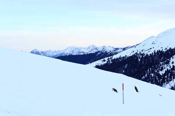 Mountain panorama with snow and sunrise in winter in Stubai Alps, Austria