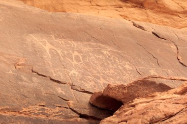 Thamudic and Nabataean petroglyphs and inscriptions on mountain in Wadi Rum desert, Jordan