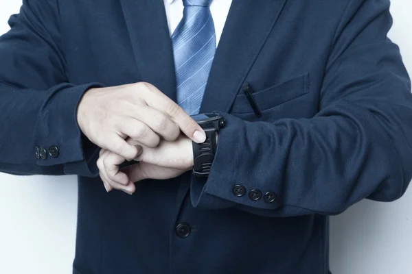 Business man looking watch in rush hour with white background