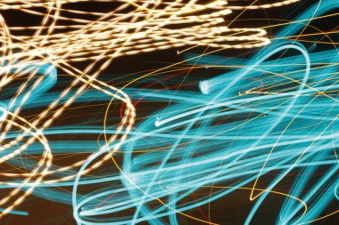 Etkisi aydınlatma, altın - soyut kavram, yangın gibi hareket satırlarında etkisi - uzun pozlama fotoğraf