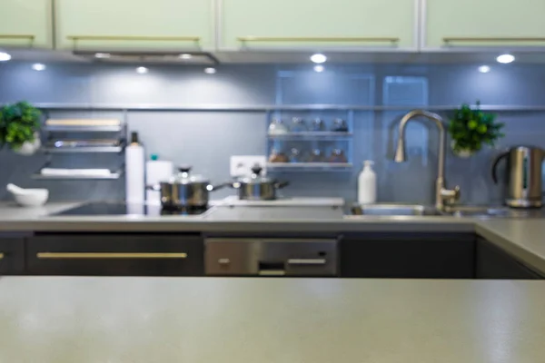 Blurred Modern kitchen at home with kitchenware — Stock Photo, Image