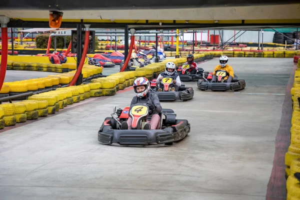 Prague, Czech Republic - 02.02.2020: Karting racers struggling on circuit in indoor go-kart track in Prague, Czech Republic — Stock Photo, Image