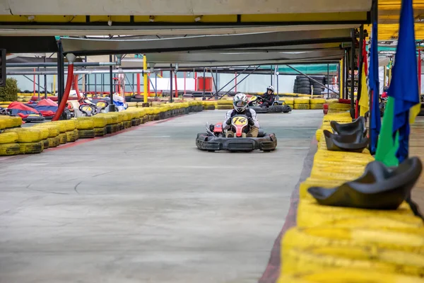 Prague, Czech Republic - 02.02.2020: Karting racers struggling on circuit in indoor go-kart track in Prague, Czech Republic — Stock Photo, Image