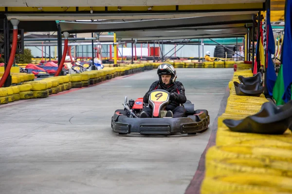 Prague, Czech Republic - 02.02.2020: Karting racers struggling on circuit in indoor go-kart track in Prague, Czech Republic — Stock Photo, Image