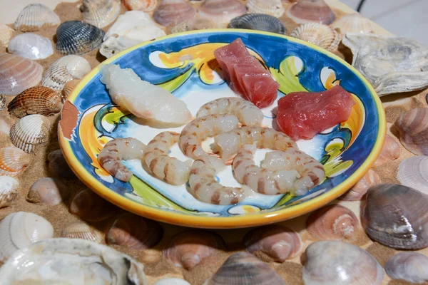 Italian fish dish Sicilian tuna, Tyrrhenian cuttlefish and Mediterranean cod