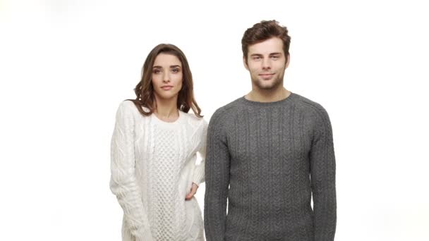 Slow-motion young couple in sweaters enjoy dancing celebrate for christmas fun together feeling attraction. — Stock Video