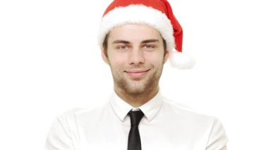 ağır çekim genç adam Noel kutlaması için kamera için konfeti üfleme.