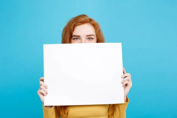 Close up Portrait young beautiful attractive redhair girl smiling showing blank sign. Blue Pastel Background. Copy space. — Stock Photo, Image