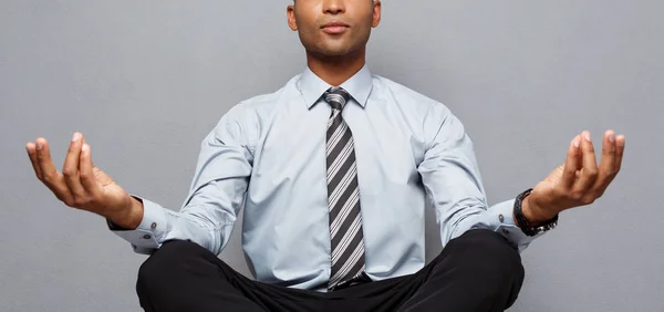 Business Concept - portrait of african american businessman doing meditation and yoga in before working. — Stock Photo, Image